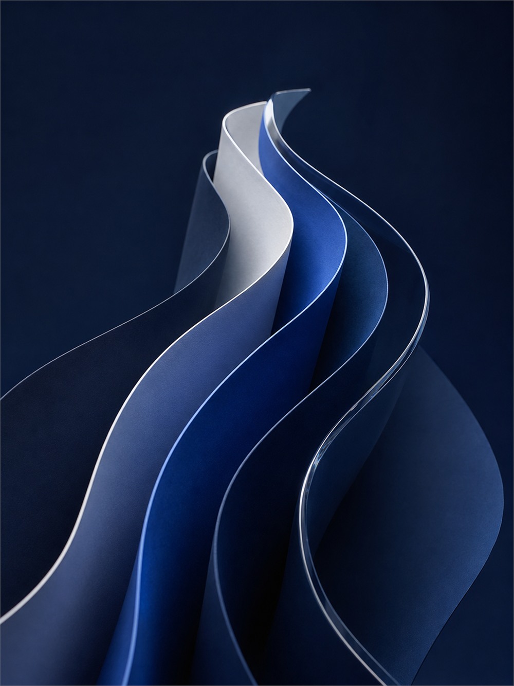 Cover of the Montlior Group Annual Report 2025: a curved navy and white paper sculpture.