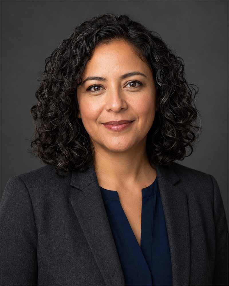 Elena Rivas, Independent Non-Executive Director of Montlior Group, in a charcoal blazer.